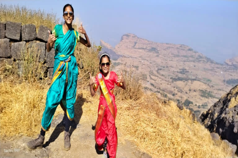 Two sisters trek wearing Nauvari Saree