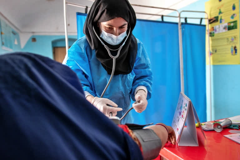 FILE - A Save the Children midwife provides Zarmina, 25, who is five months pregnant, with a pre-natal check-up in Jawzjan province in northern Afghanistan, Sunday, Oct. 2, 2022. (Save the Children via AP, File)