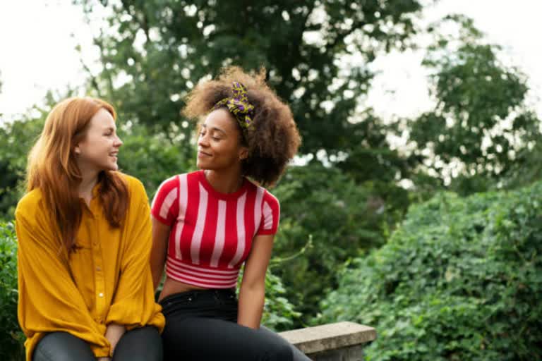 Female friends sitting and talking