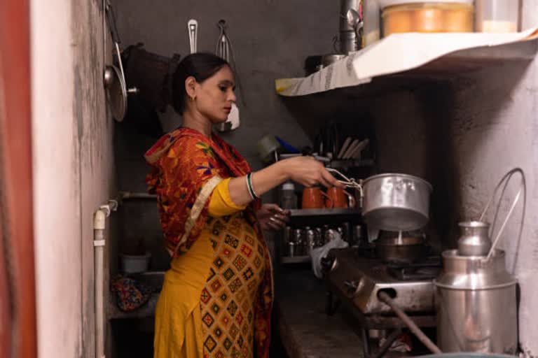 an woman preparing tea