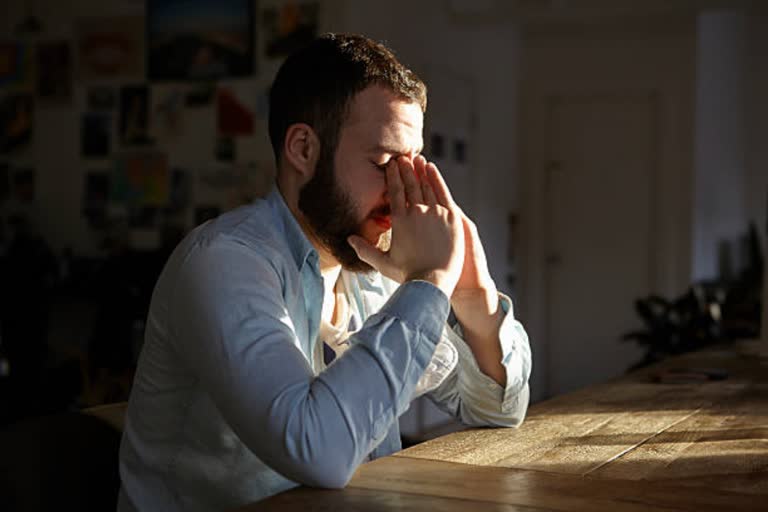 depressed young man sitting