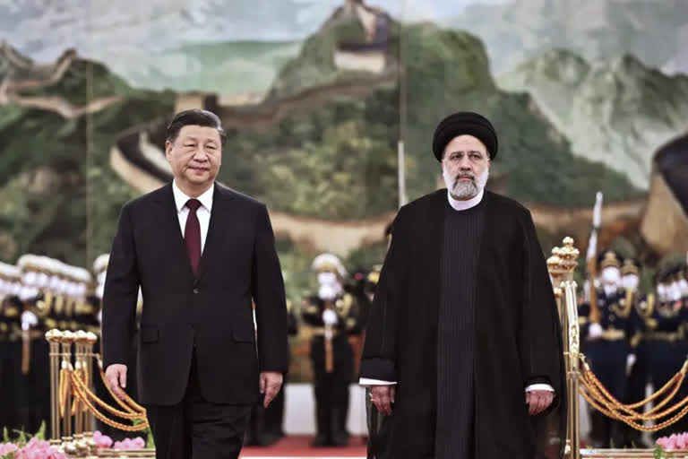 XI Jinping and  Ebrahim Raisi