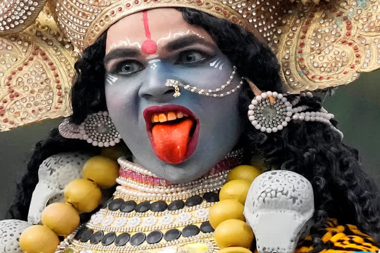 A devotee dressed as Hindu goddess Kali participates in a procession on the eve of Shivaratri festival in Jammu, India, Friday, Feb. 17, 2023. (AP Photo/Channi Anand) A devotee dressed as Hindu goddess Kali participates in a procession on the eve of Shivaratri festival in Jammu, India, Friday, Feb. 17, 2023. (AP Photo/Channi Anand)