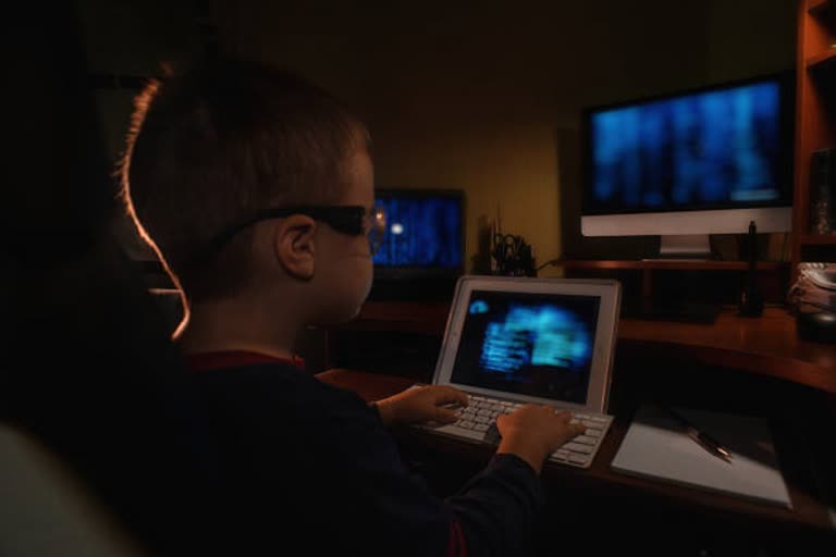 little boy coding at home