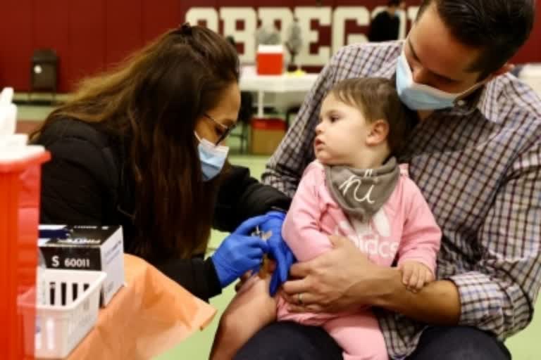 female doctor examining a child