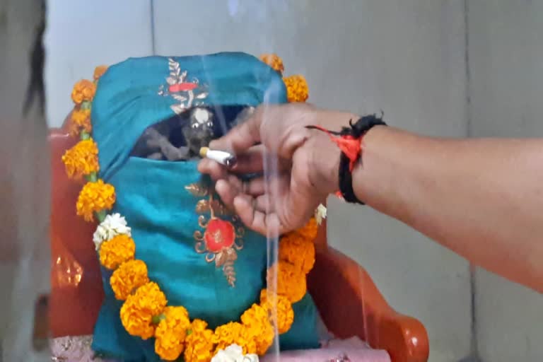 Smoky ritual of a Surat temple where cigarettes are offered to deity