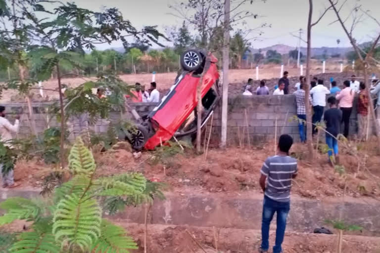 The car overturned after crossing the pavement