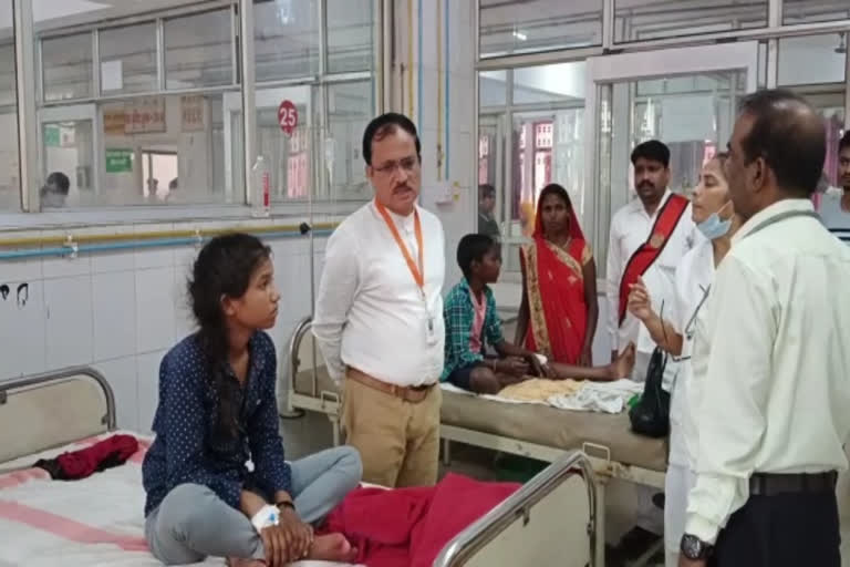 CMO Dr Sandeep Choudhary examining patients at a Varanasi hospital