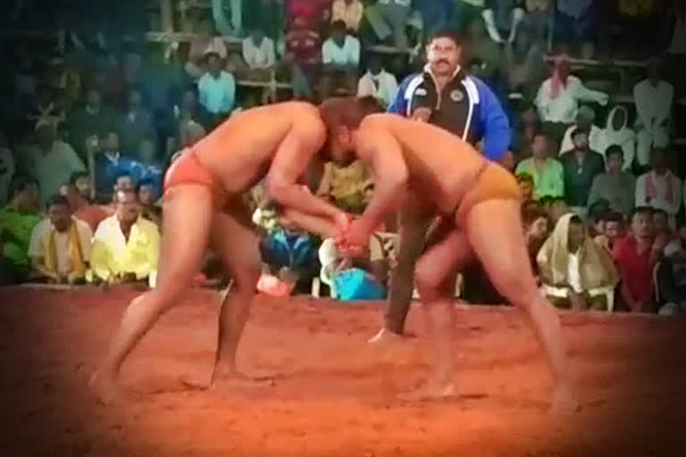 A wrestling competition in the red soil of Hanuman arena in yavatmal