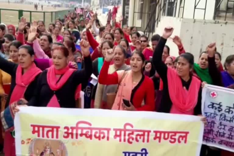 march against women exploitation in mandi