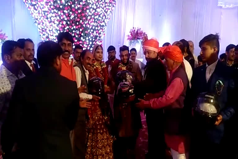 distributed helmets to the guests at the wedding