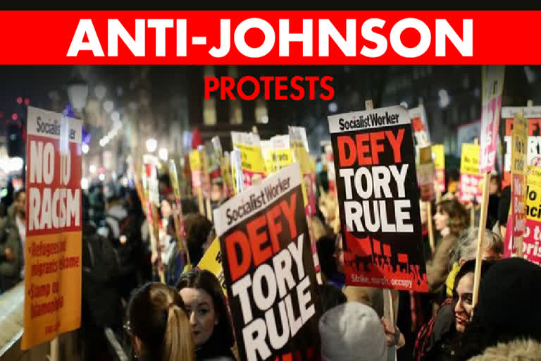 People scuffle with police during an anti-Boris Johnson demonstration at Trafalgar Square in central London, on Friday.