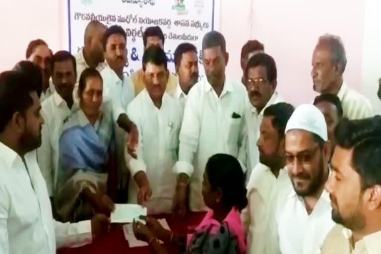 MLA Vital Reddy distributed the checks at nirmal district