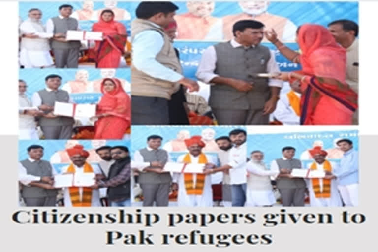 Union Minister gives citizenship papers to Pak refugees