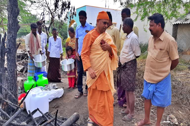 Swamiji helps a family who lost their house in a fire accident, Swamiji helps a family who lost their house in a fire accident