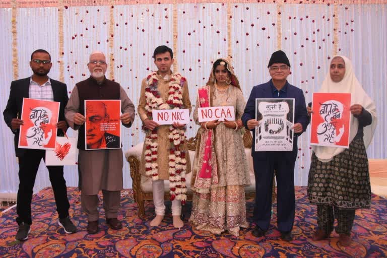 Jamia student, groom pose with anti-CAA placards during wedding