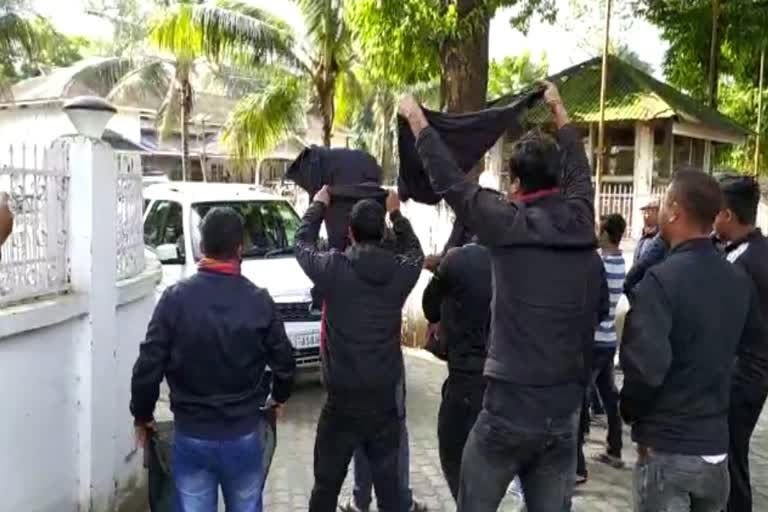 protesters shows black flag to Naba Doley and Pradan Barooah