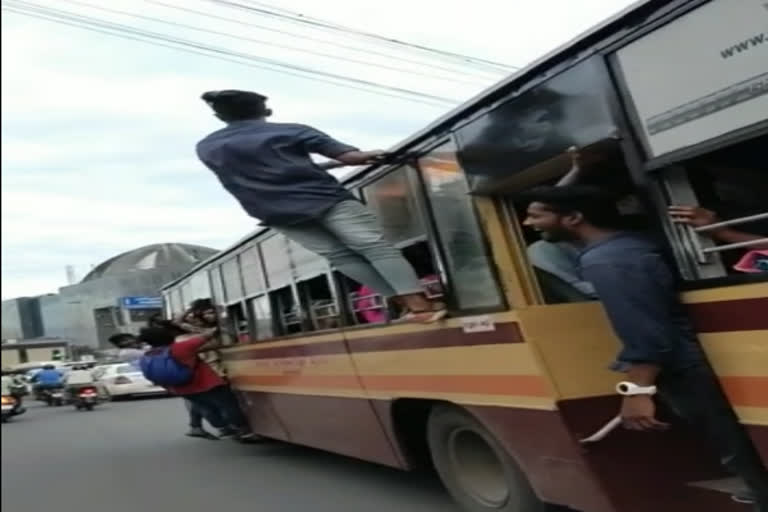 Climbing on the roof of the bus