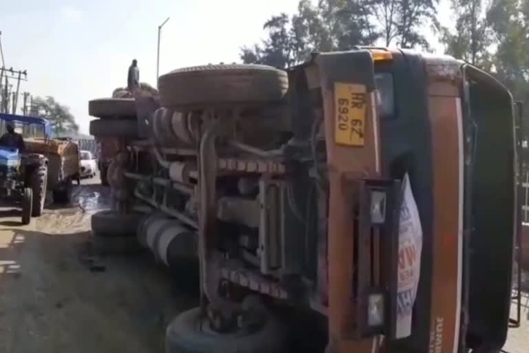 overturned truck on road under construction in tohana