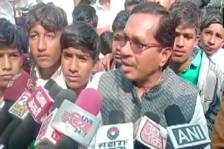 BJP MLA protests with school students