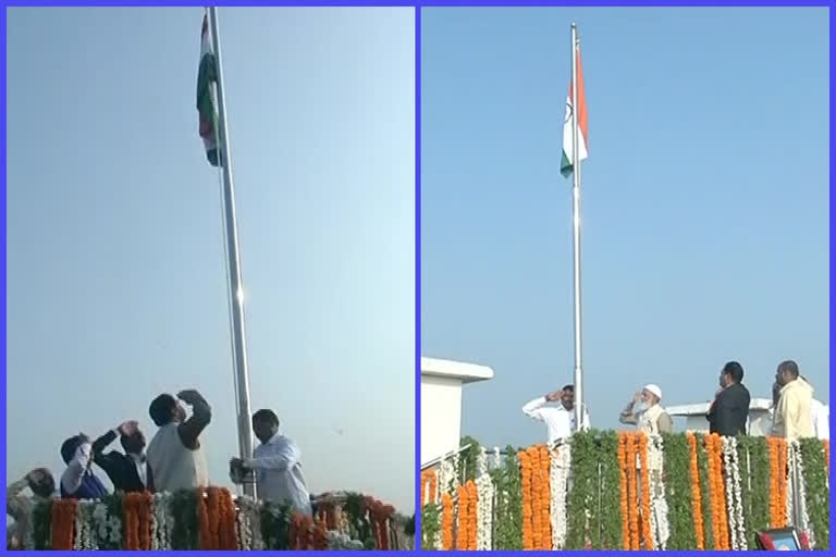 speaker and council chairman hoists flag