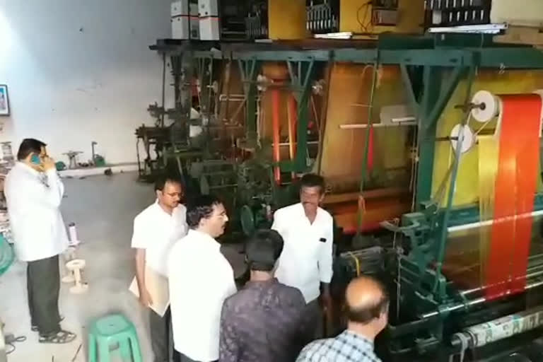 Enforcement officers inspect the Power looms