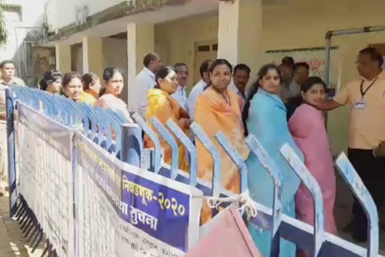 voters checking at polling station yavatmal