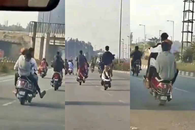 Youths Bike Wheeling on Airport Road