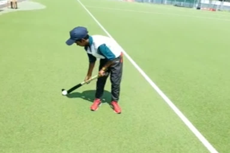 Kerala: 13-yr-old Hockey aspirant looks on as national players sweat it out