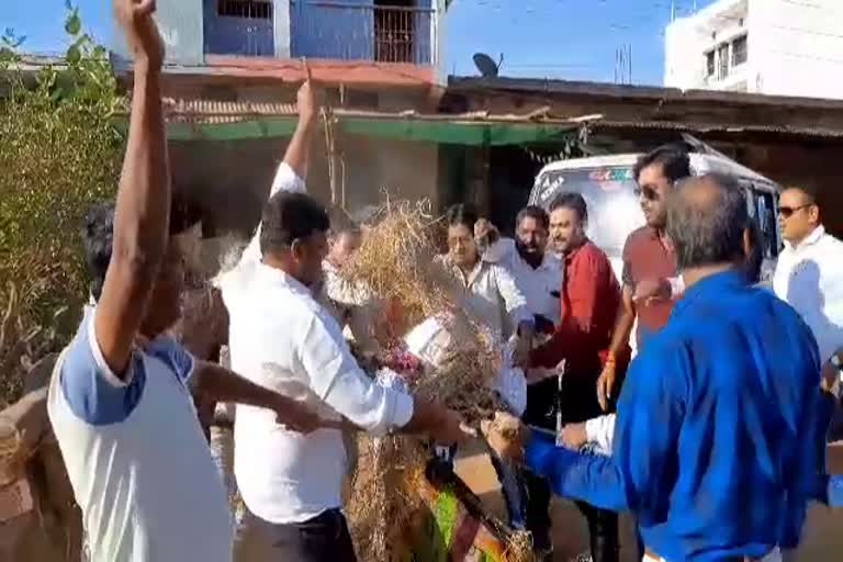 BJP members Blow effigy of the CM