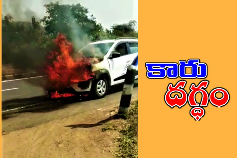 car fire on national high way at adilabad