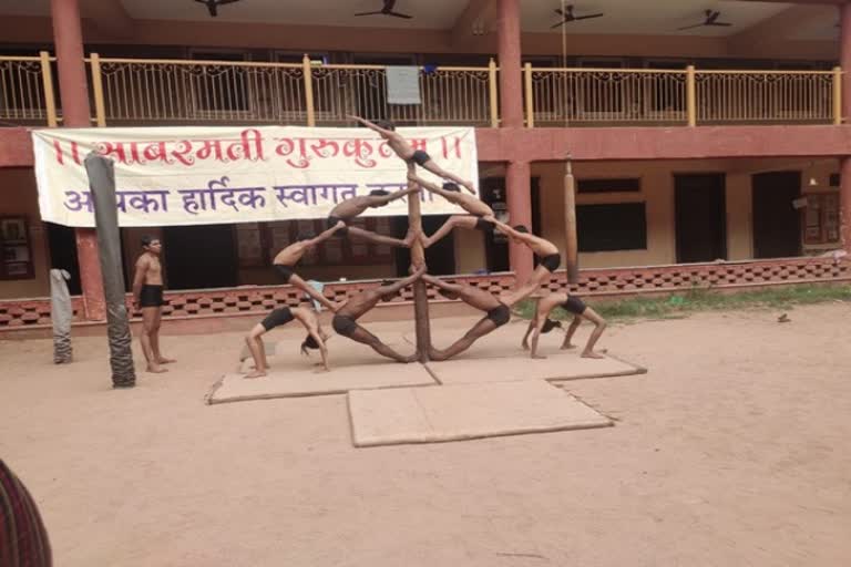 Gujarat: A group of 15 students of Sabarmati Gurukulam is practicing  Mallakhamba