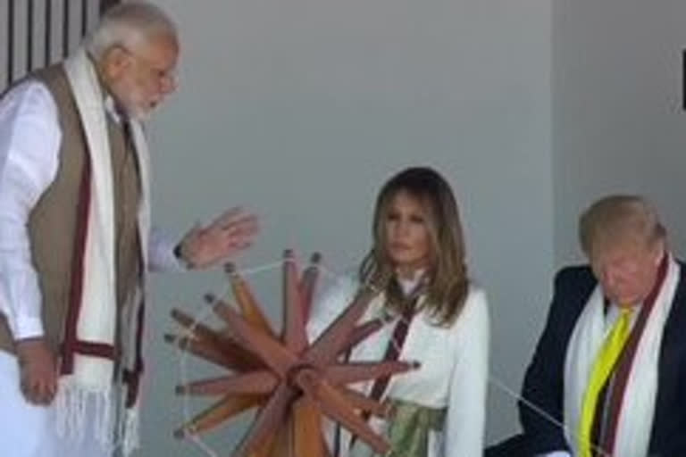 Trump, wife try spinning ''charkha'' at Sabarmati Ashram