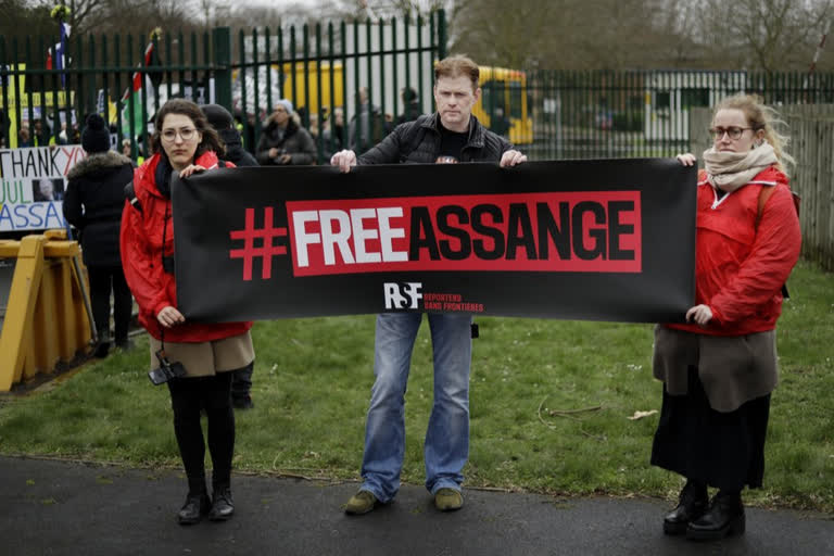 Supporters hold a banner which reads 'Free Assange' as they protest against the extradition of Wikileaks founder Julian Assange outside Belmarsh Magistrates Court
