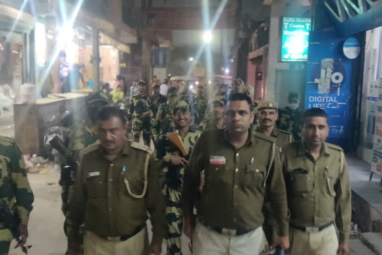 Delhi police flag march after false rumors of riots in south east delhi