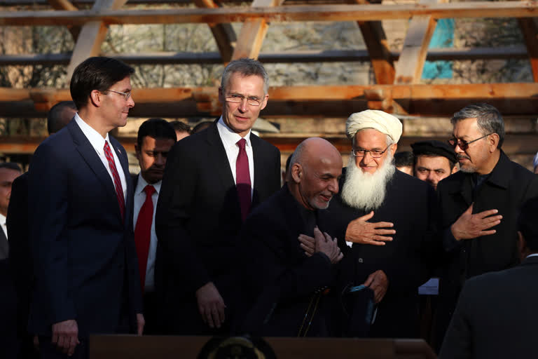 Afghan President Ashraf Ghani, center, arrives with NATO Secretary General Jens Stoltenberg, and U.S. Secretary of Defense Mark Esper for a joint news conference in presidential palace in Kabul, Afghanistan