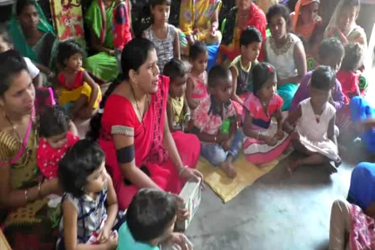 Anganwadi workers protested by wearing black band