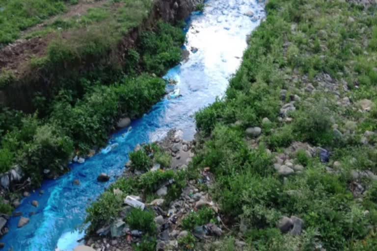 river polluted by the dirty water of factories in Solan