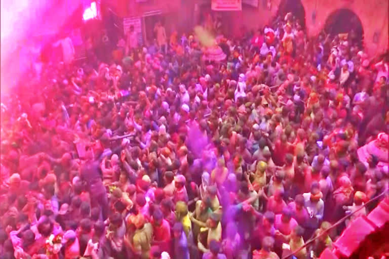 people-celebrating-the-festival-of-holi-at-banke-bihari-temple-in-mathura