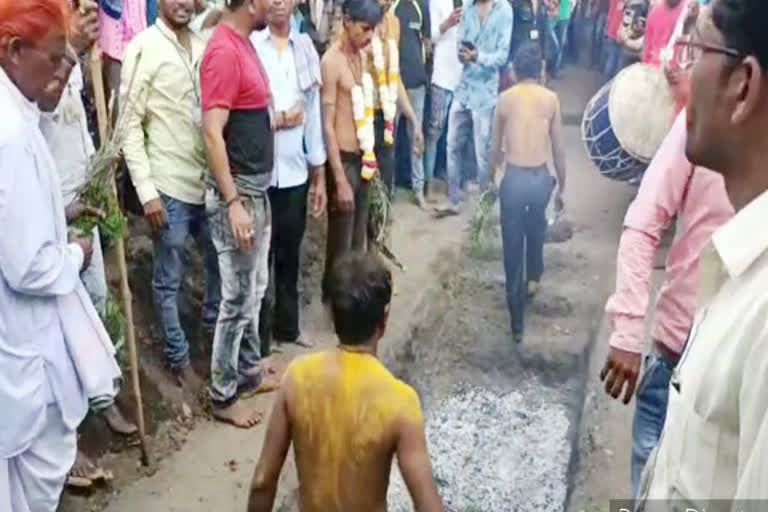 Here villagers walk on burning coals to fulfill the vow