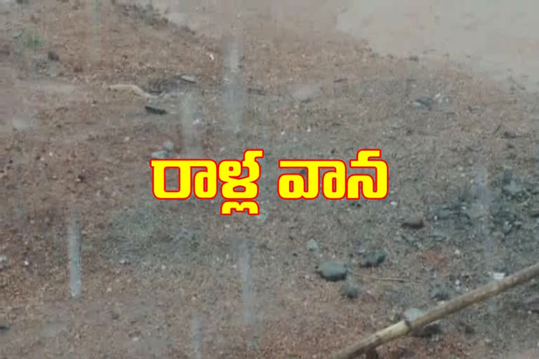 rain water stones came on roads at siddipet