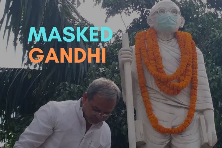 BJP leader adorns Gandhiji with a face mask to protect his thoughts