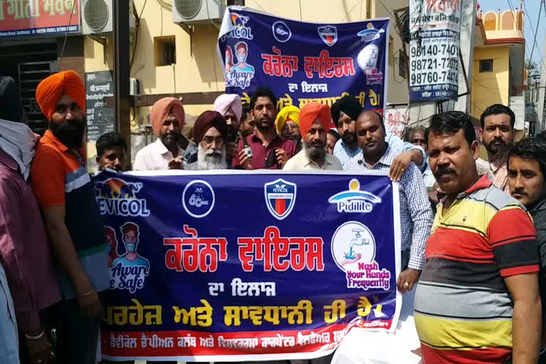 COVID-19: bathinda carpentor union distribute masks and sanitizer