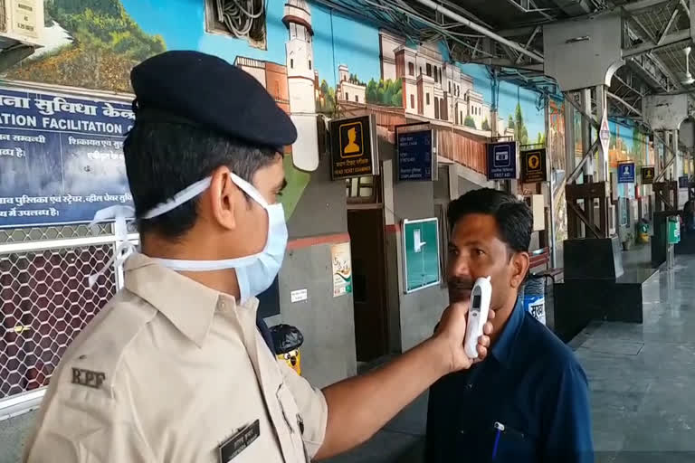 Thermal scanning of passengers at indore railway station