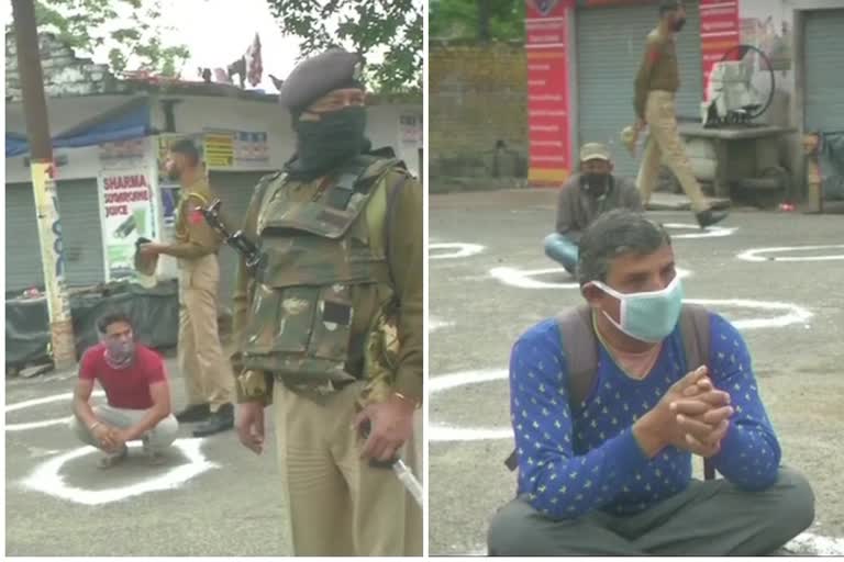 eople who were flouting restrictions that have been imposed amid lockdown, made to sit in circles drawn to maintain social distance, in Jammu.