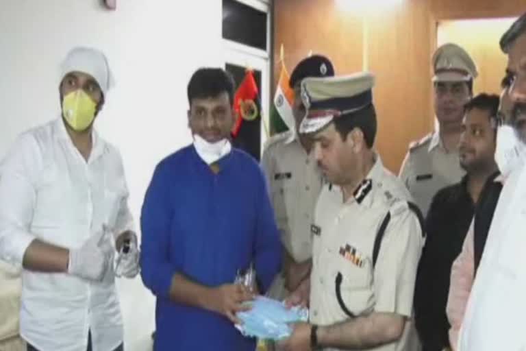 social organizations gave sanitizers and masks to police commissioner gurugram