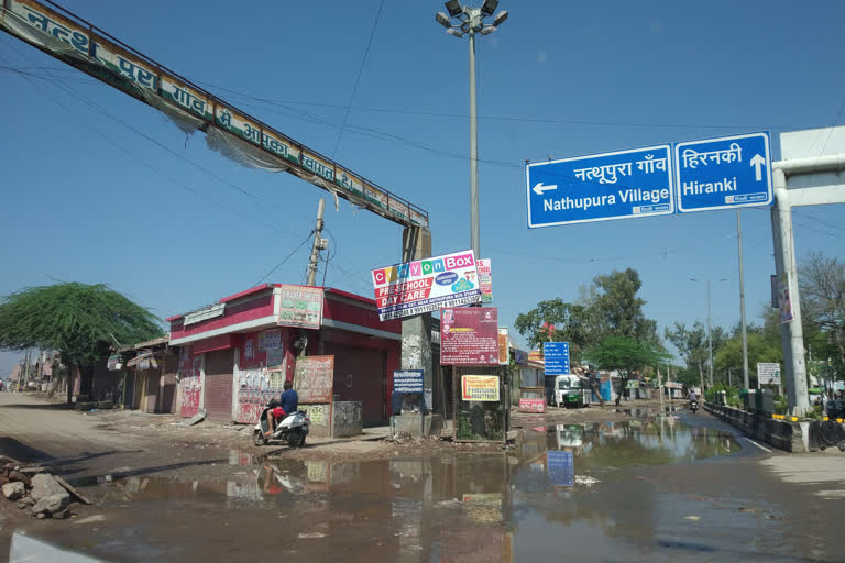 dirty rain water is filled on the road of Burari