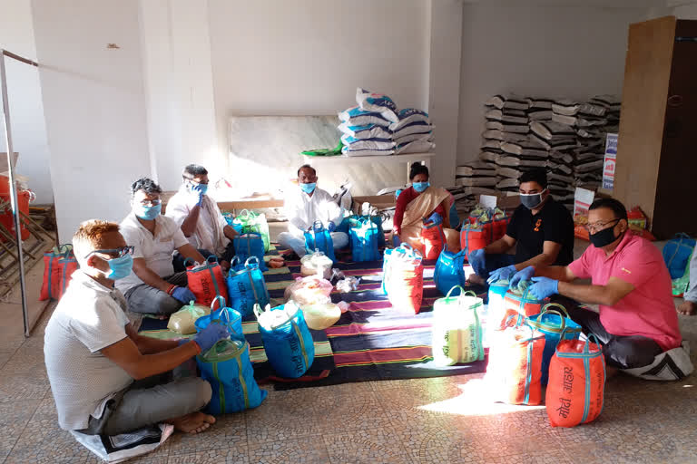 Former Welfare Minister Dr. Louise Marandi prepares food packets for the needy