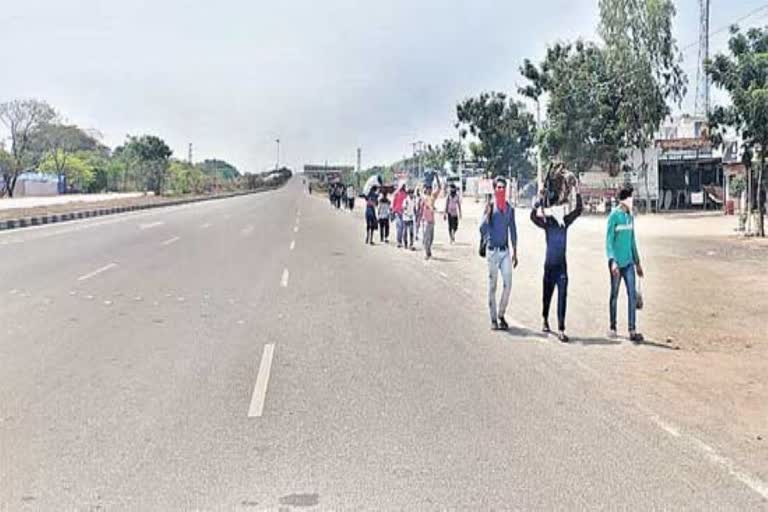 people-walk-on-national-highways-in-medak-district-due-to-lock-down-effect