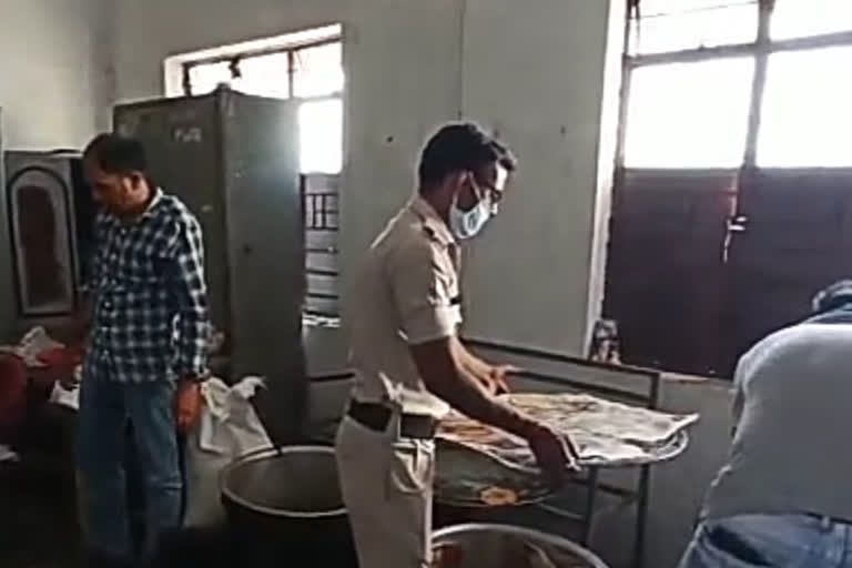 Police feeding food to the poor